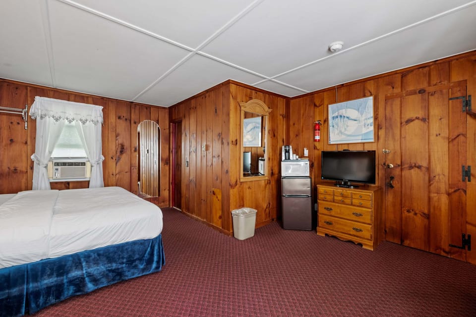 This unit features a king bed, Roku TV, mini-fridge, microwave, and coffee bar for added convenience.