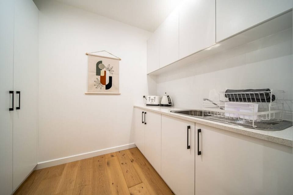 The butler’s pantry offers extra storage and prep space, keeping the main kitchen clutter-free.