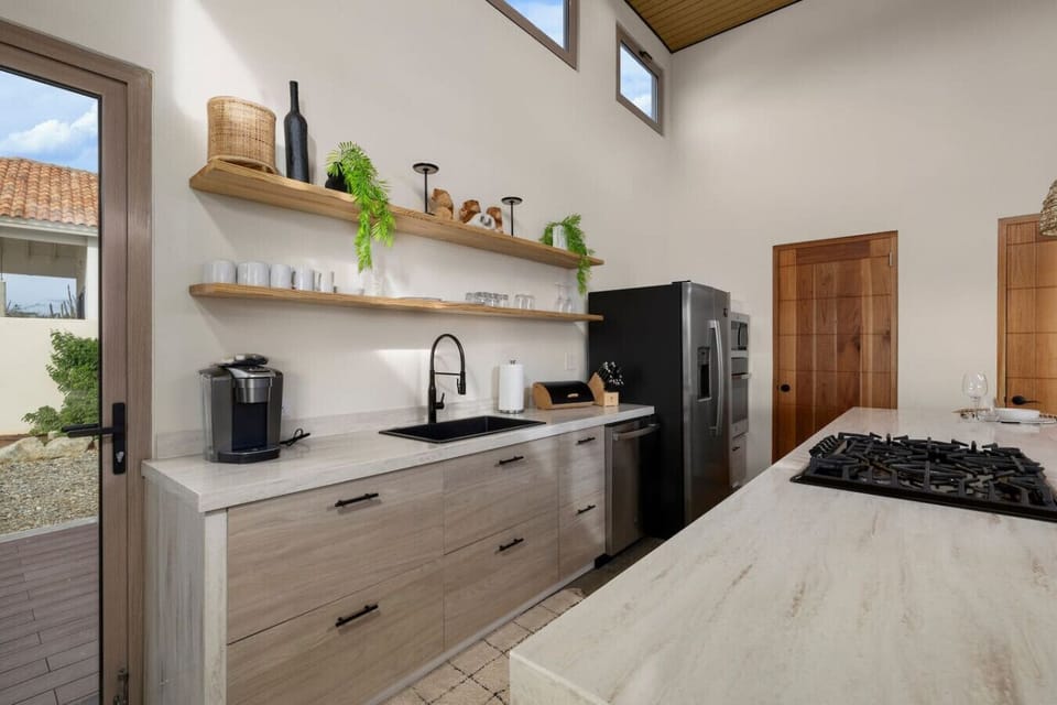 Whip up something delicious in this warm, welcoming kitchen at Halifat 5—where every detail is made for comfort, style, and gathering around good food.