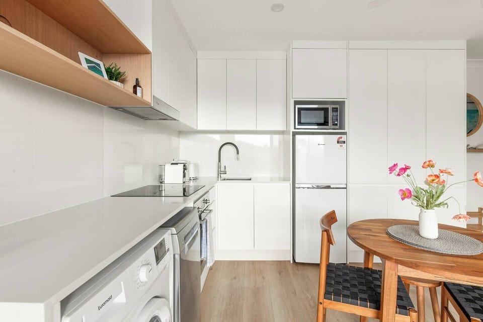 Whip up your favourite meals in the compact kitchen featuring an oven, dishwasher, and all the essentials for effortless dining in.