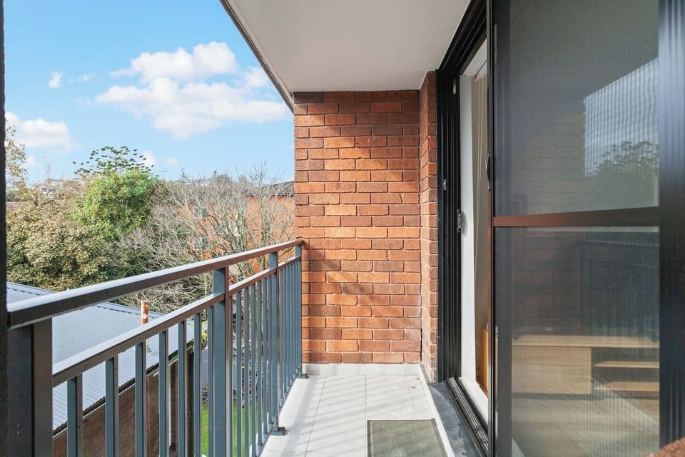 This private balcony offers a peaceful treetop outlook—perfect for soaking up the morning sun or unwinding in the fresh air.