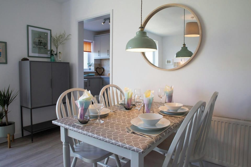 Dining area with door leading to kitchen