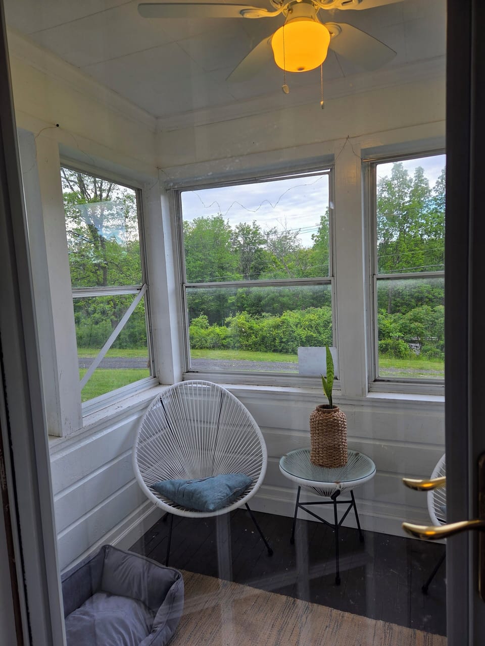 Furnished enclosed porch with fan 