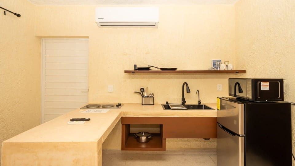 Everything you need to cook at home: stove, fridge, microwave, French press, and more.
