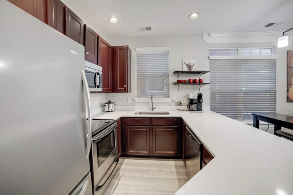 Kitchen with quartz countertops & coffee station.