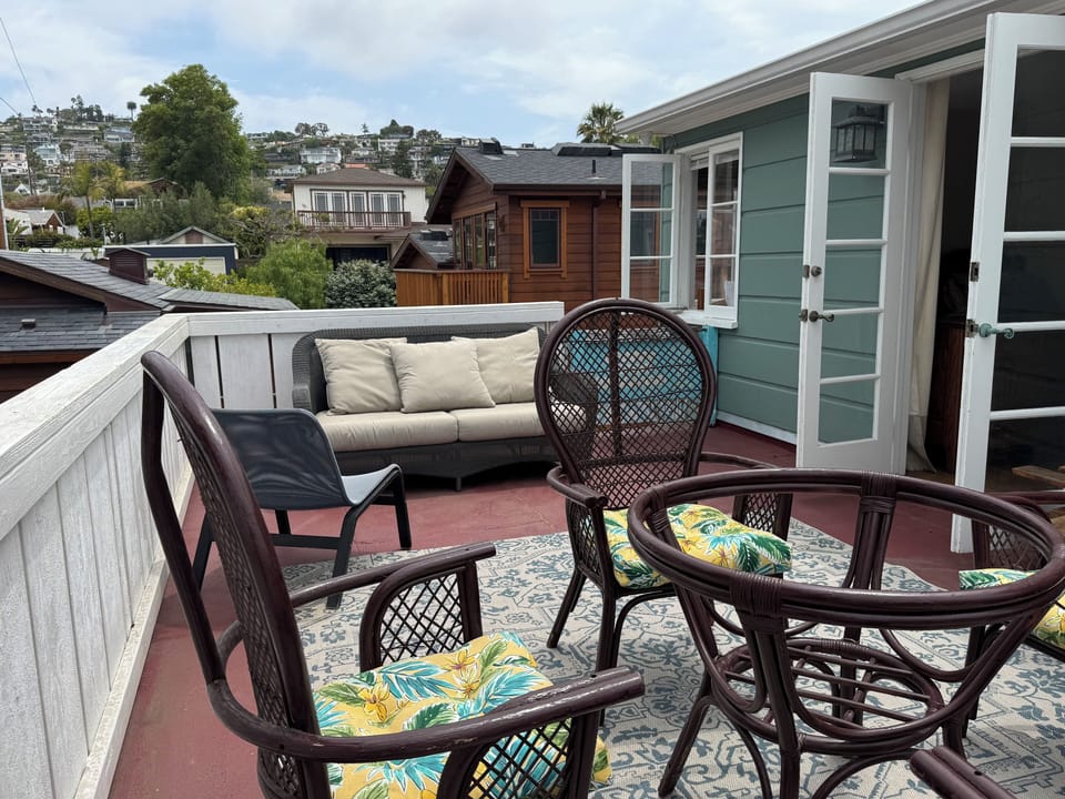 Large private deck with ocean view to one side and hills to the other 