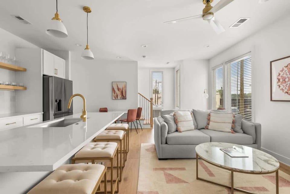 Large Living Room and Kitchen Island. 4K Smart TV located in Living Room