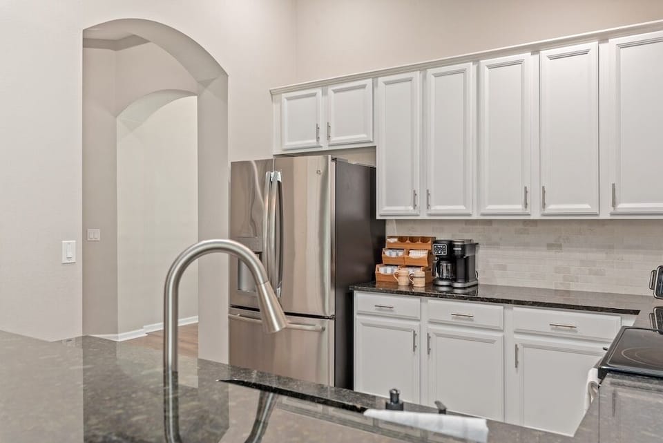 Large fridge and freezer with water and ice for your convenience.
