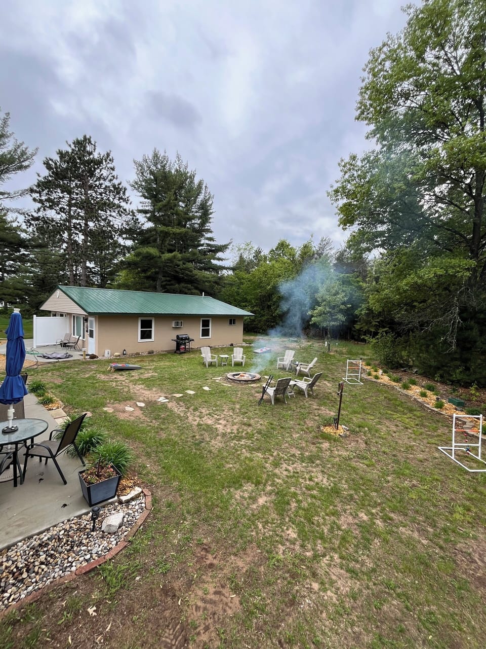shared fire pit and gas grill with out door games available for entertainment