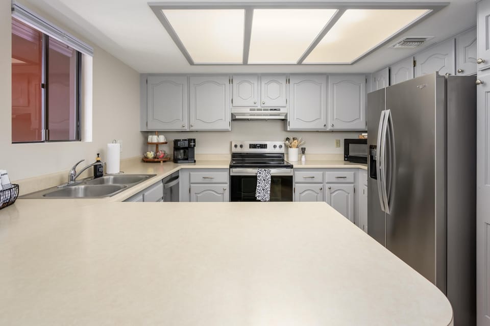 Fully furnished kitchen with all pots, pans, dishes and glassware.