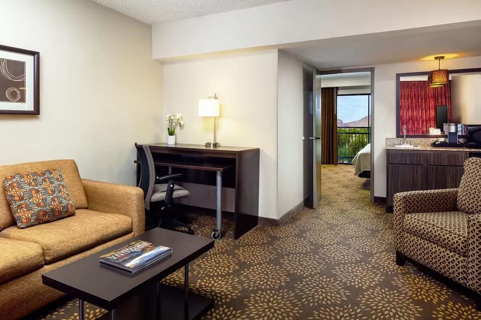 Relax in the airy living area with easy flow to bedroom.