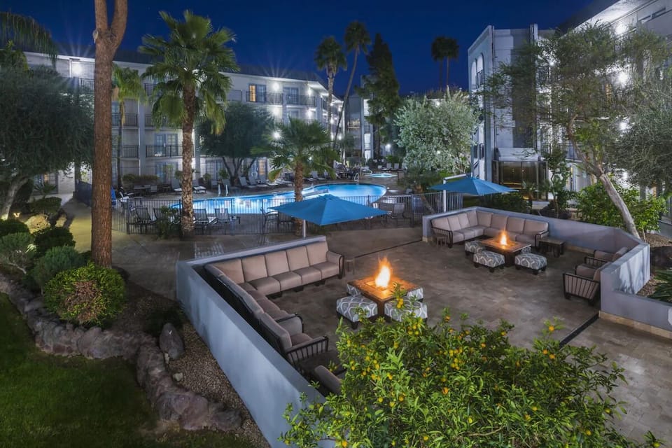 Unwind by glowing fire pits beside the sparkling pool.
