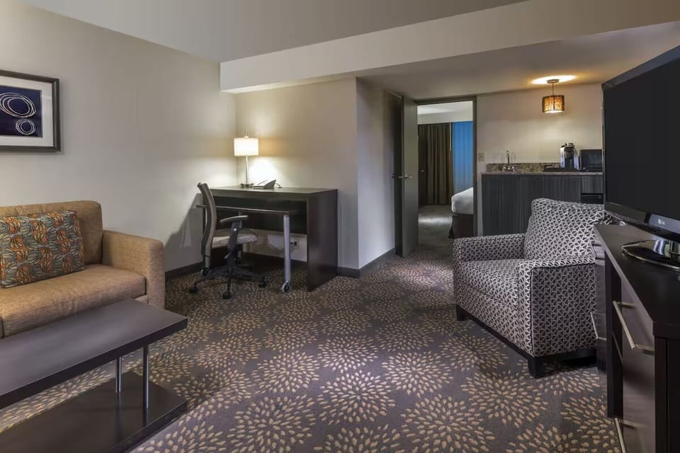Settle into the spacious suite with lounge seating and TV.