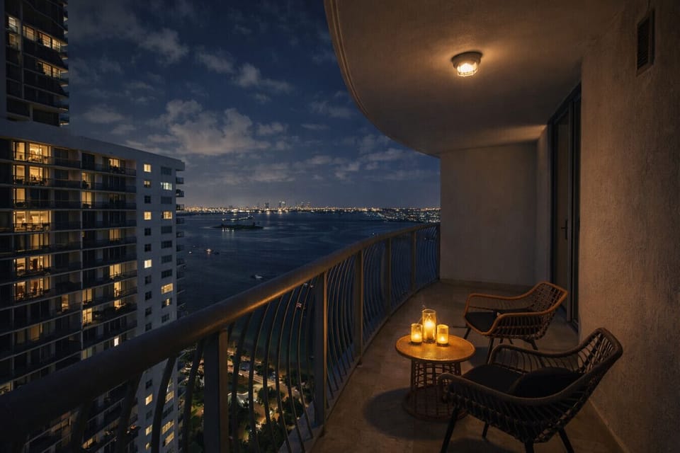 Private balcony with stunning Biscayne Bay night views — perfect for relaxing after exploring Miami.