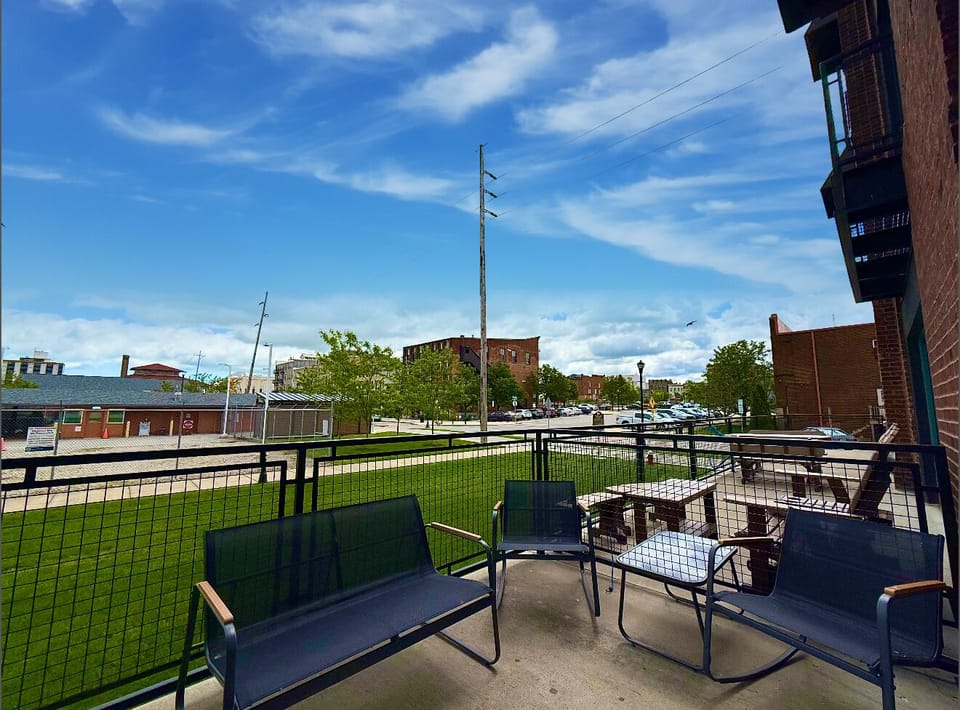 Cityside Charm
Relax in this cozy corner of the patio with views of the historic downtown district and easy access to local attractions.

