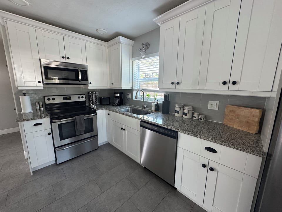 updated kitchen with cooking staple (salt/pepper, oil/vinegar & spices)