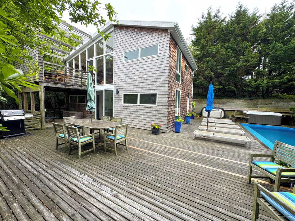 Pool and Hot tub deck, grill and downstairs outdoor dining area 