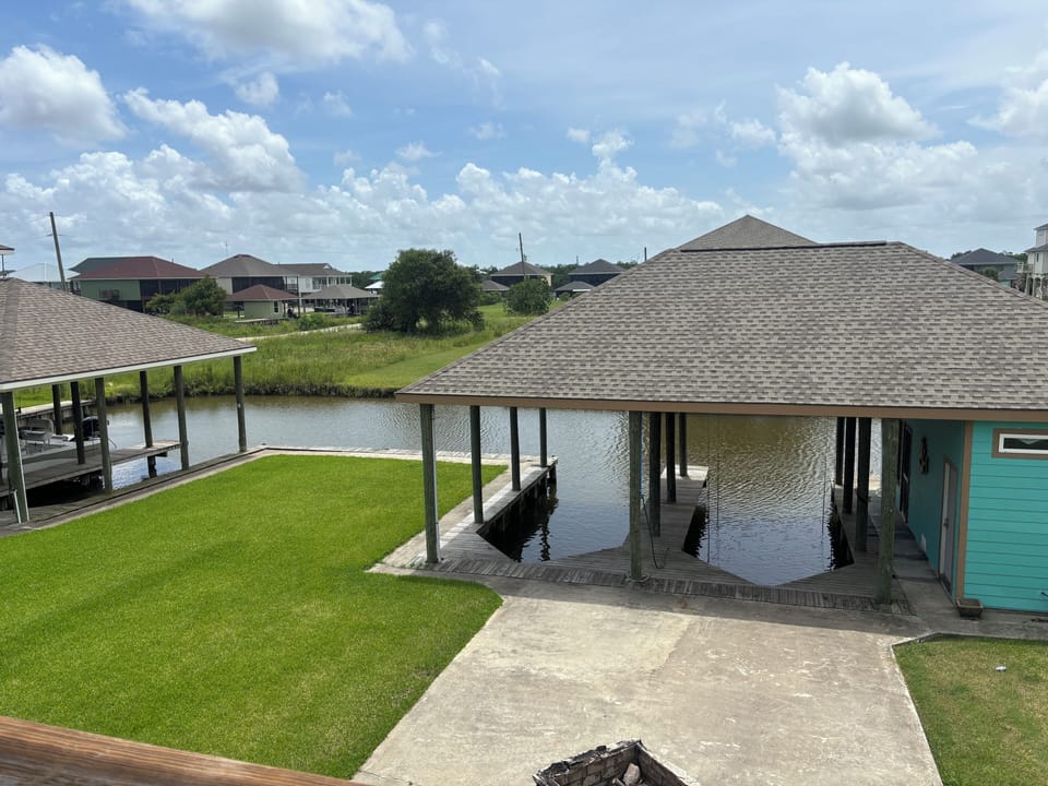 Boat slips, boathouse, dock and backyard