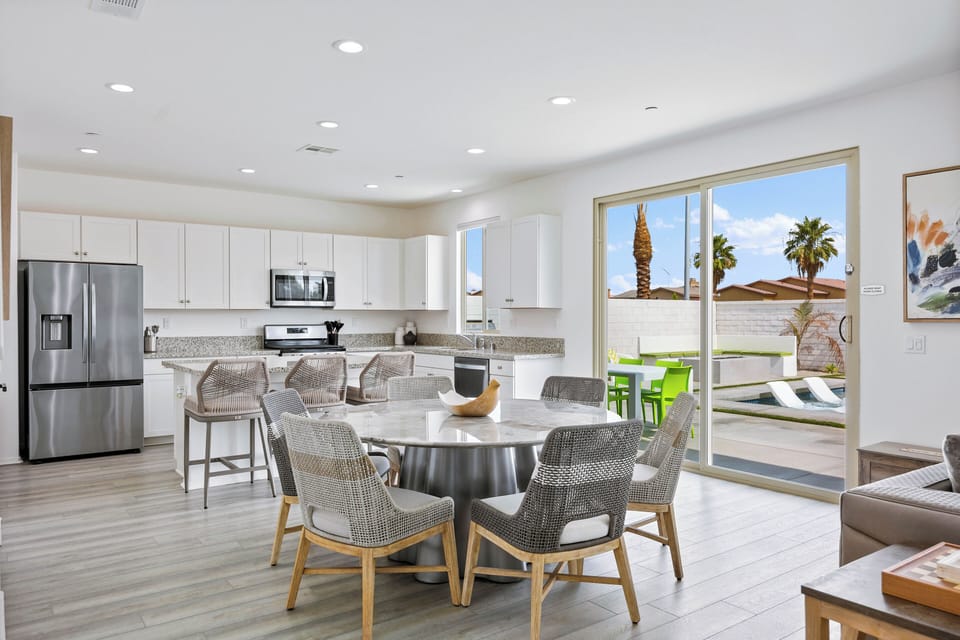 Open kitchen and dining area with glass doors.