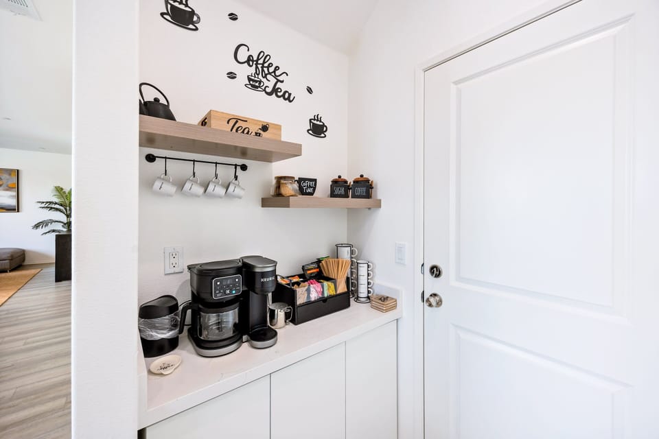 The coffee station is conveniently located in the kitchen. Start your mornings hassle-free!