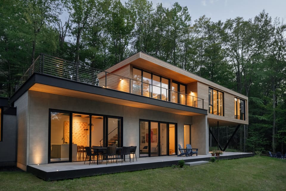 Modern architectural home with floor to ceiling windows to enjoy nature.