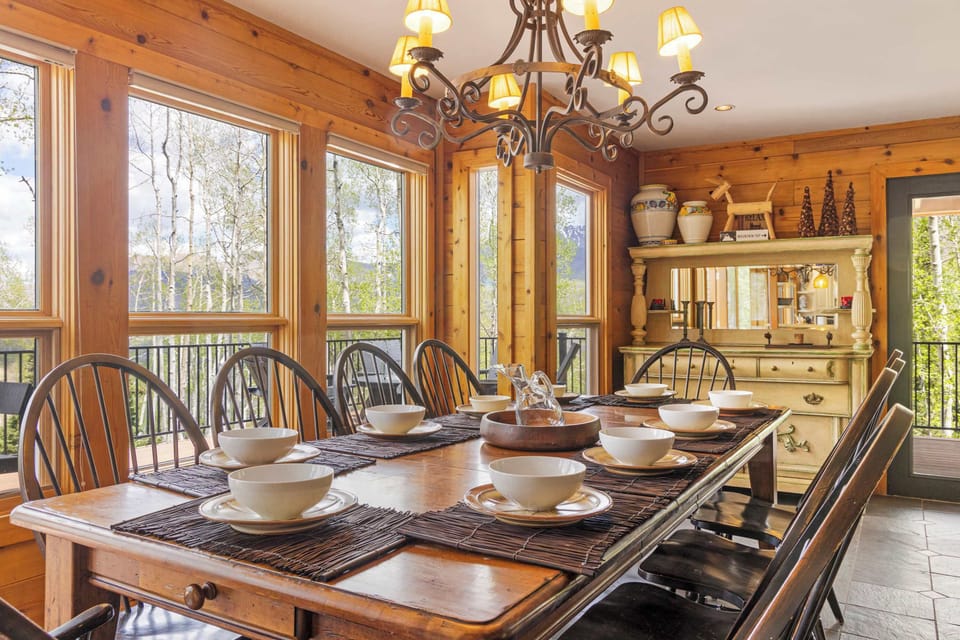 Dining area: Main floor, table seating for 10, deck access, adjacent to living room