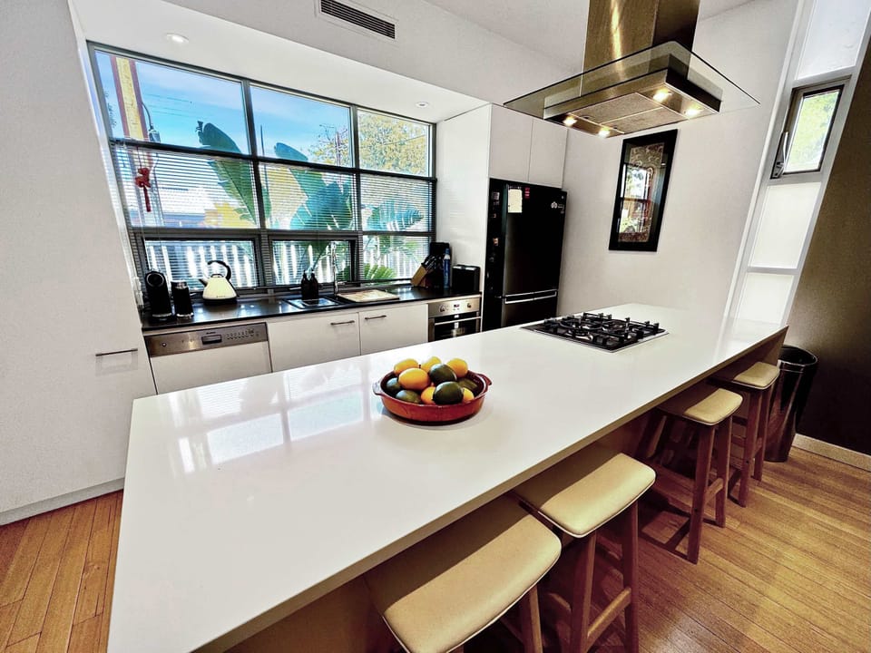 Kitchen bench doubles as breakfast bar.
