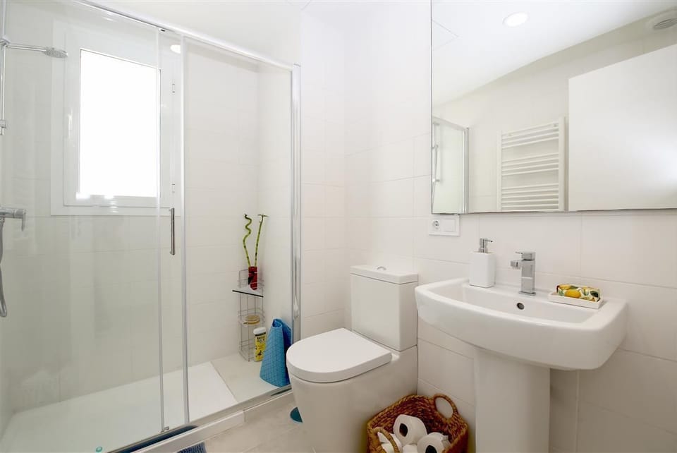 Family bathroom with shower, toilet and hand-basin