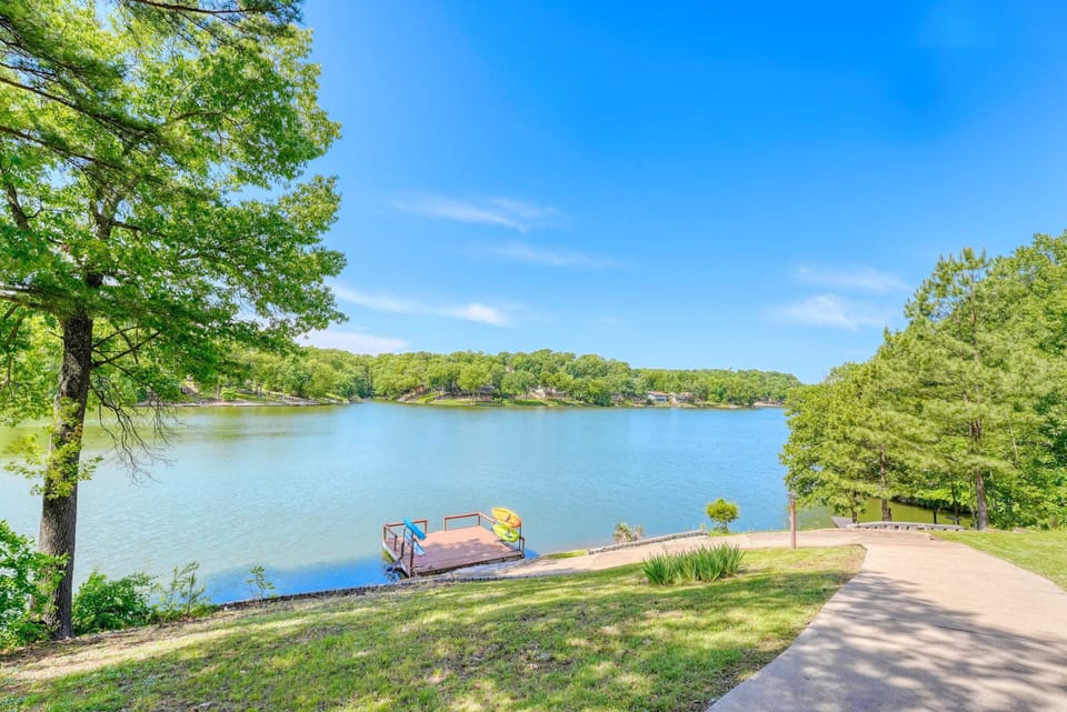 Stunning lakefront view from the lawn with our private dock—perfect spot for sunrise coffee or sunset wine.