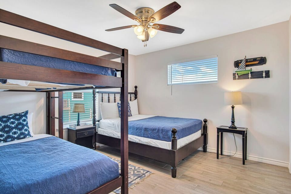 Bedroom 3 features a Twin-over-Twin bunk bed, a Double bed, and shared bathroom access. 