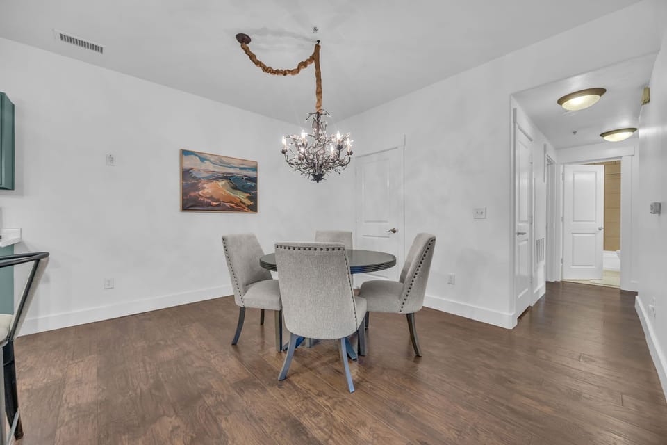 Dining area: Main floor, table seating for 4, 4 barstools at island