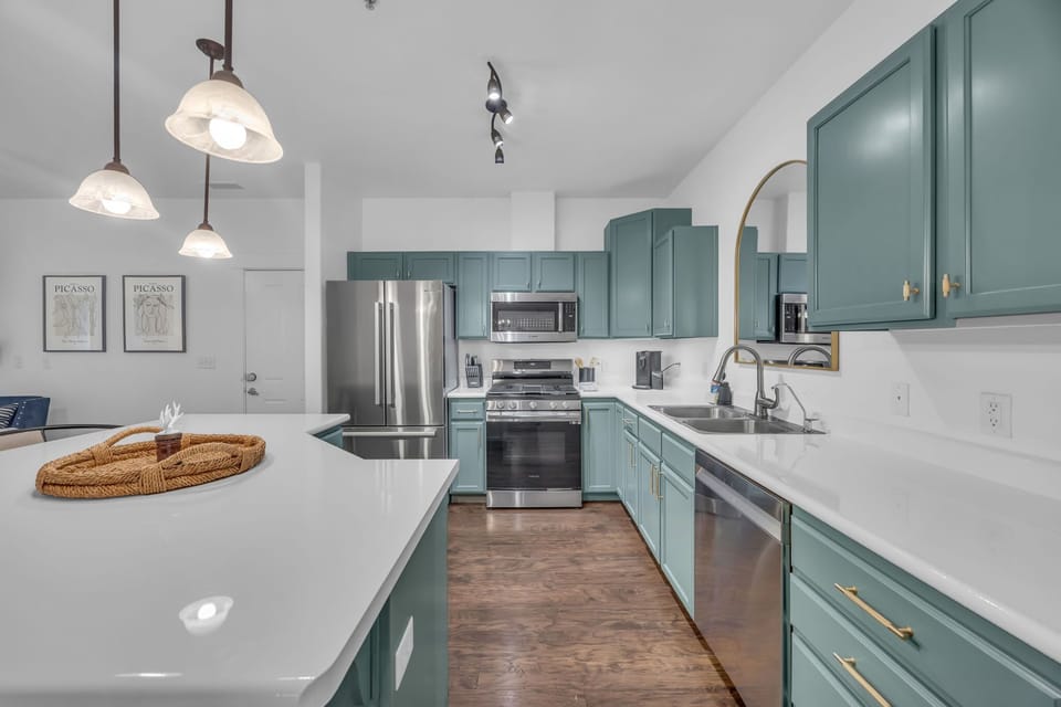 Kitchen: Main floor, drip coffee maker, Keurig, toaster, cooking utensils, tableware