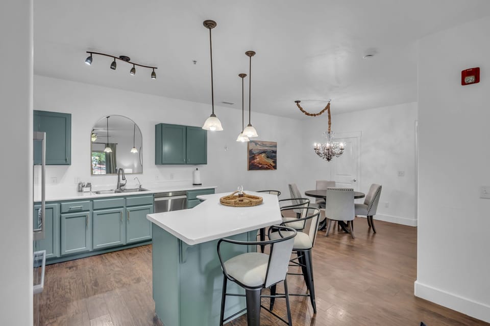 Kitchen: Main floor, drip coffee maker, Keurig, toaster, cooking utensils, tableware