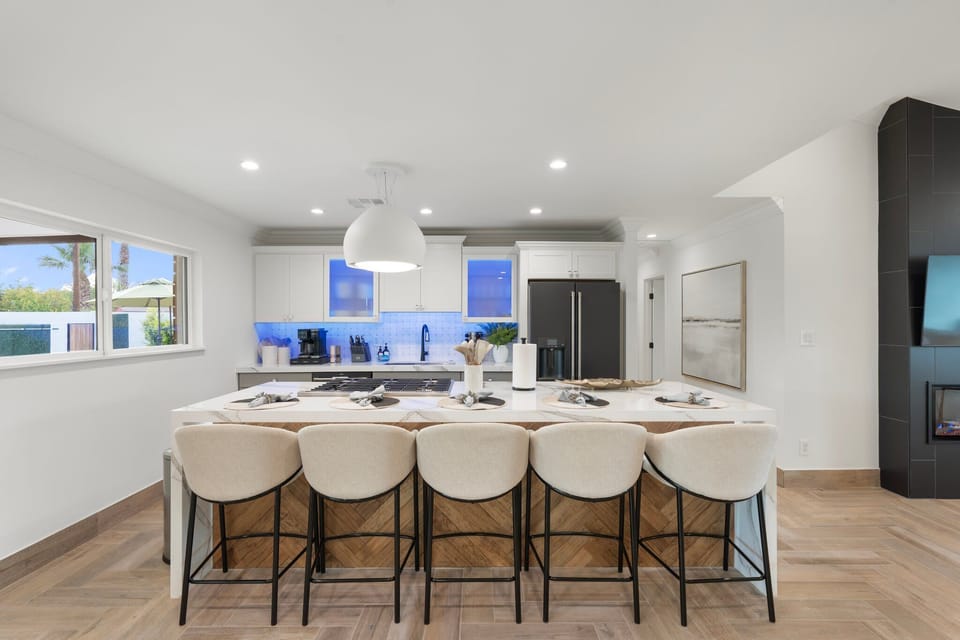 Island seating for 5, custom quartz counters and high end appliances