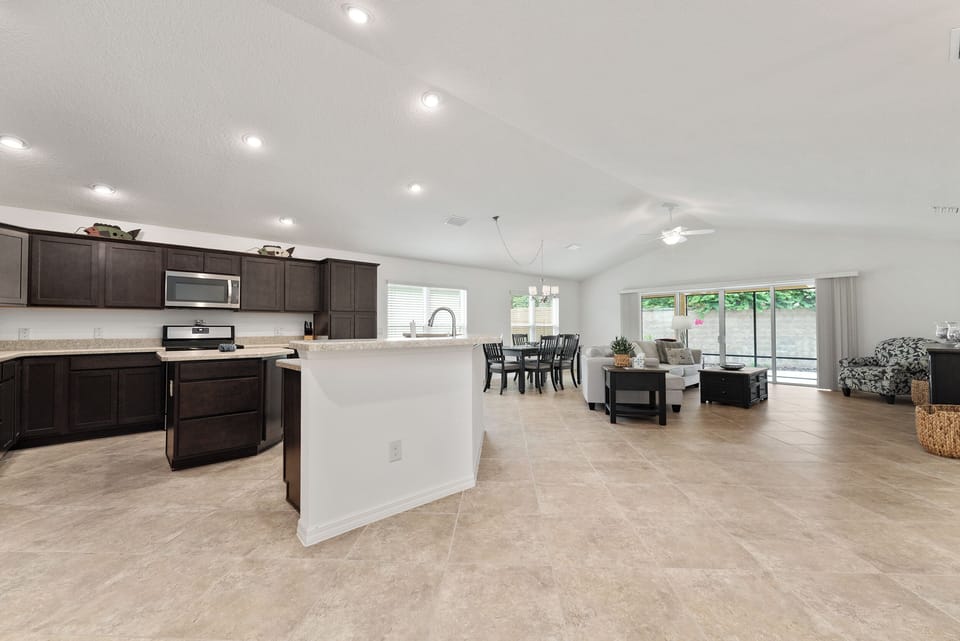 Coming into an open concept: kitchen, living room and dining room