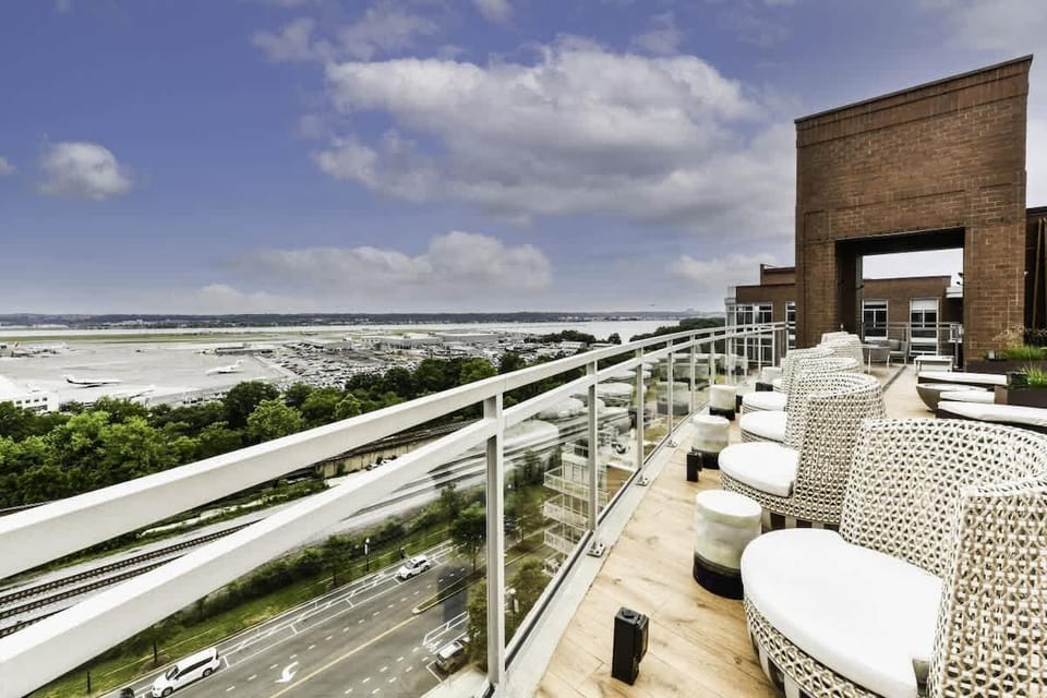 Social rooftop with scenic city view.