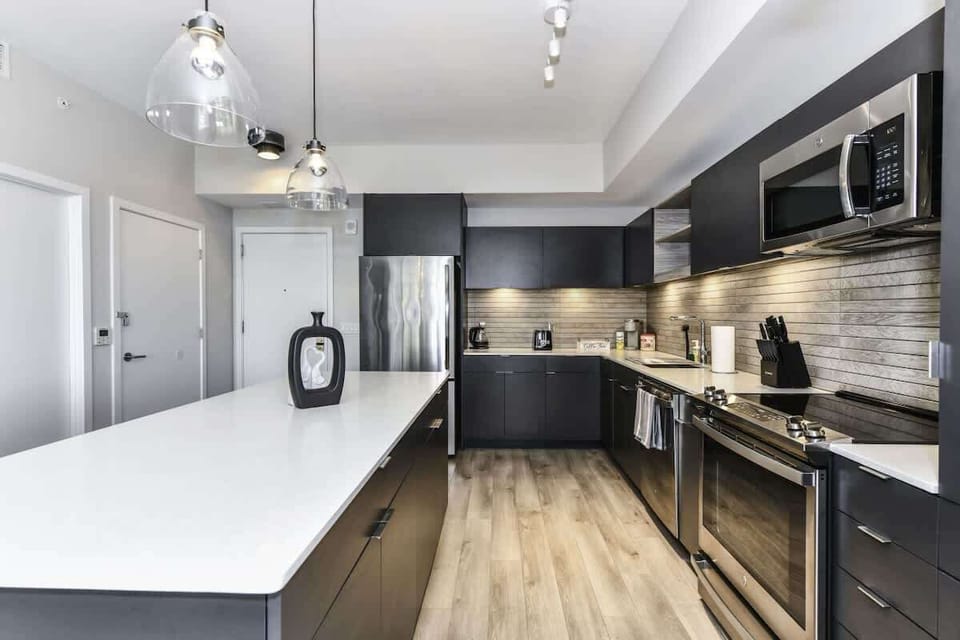 Fully equipped kitchen with a breakfast counter (seats 3) and a dining area (seats 4), plus a high chair available for little ones.
