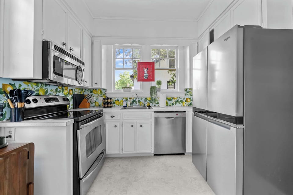 "Fully equipped kitchen with modern appliances and plenty of space to cook, gather, and enjoy meals together."
