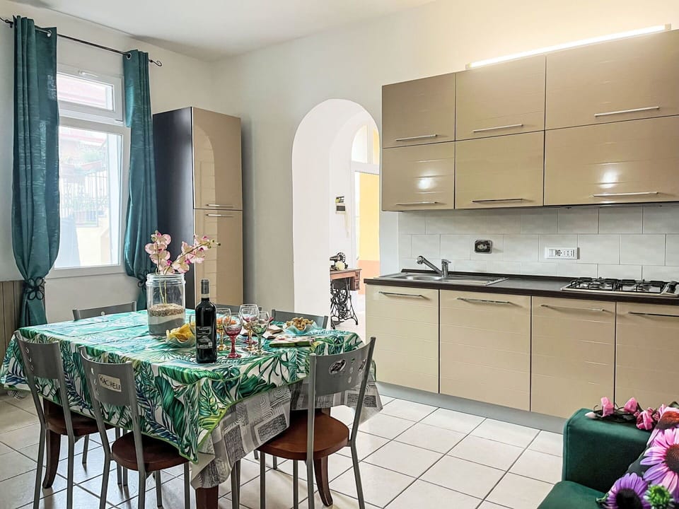 Furniture, Interior Design, Kitchen, Kitchen Appliance, Flooring, Major Appliance, Countertop, Floor, Cabinetry, Room