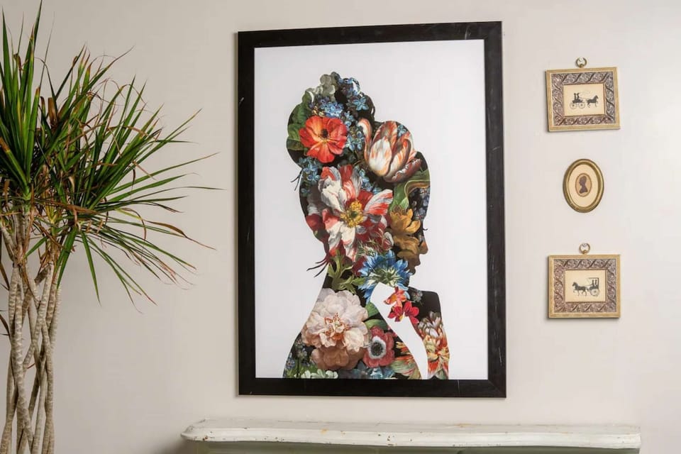 Framed flower silhouette art on beige wall