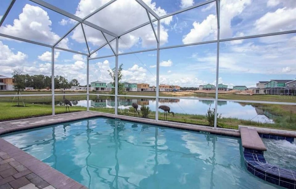 Dive into relaxation in your private screened pool, perfect for sunny Florida days ☀️ or evening dips under the stars ✨. Complete with loungers and a BBQ area for unforgettable family moments. 🌴💦