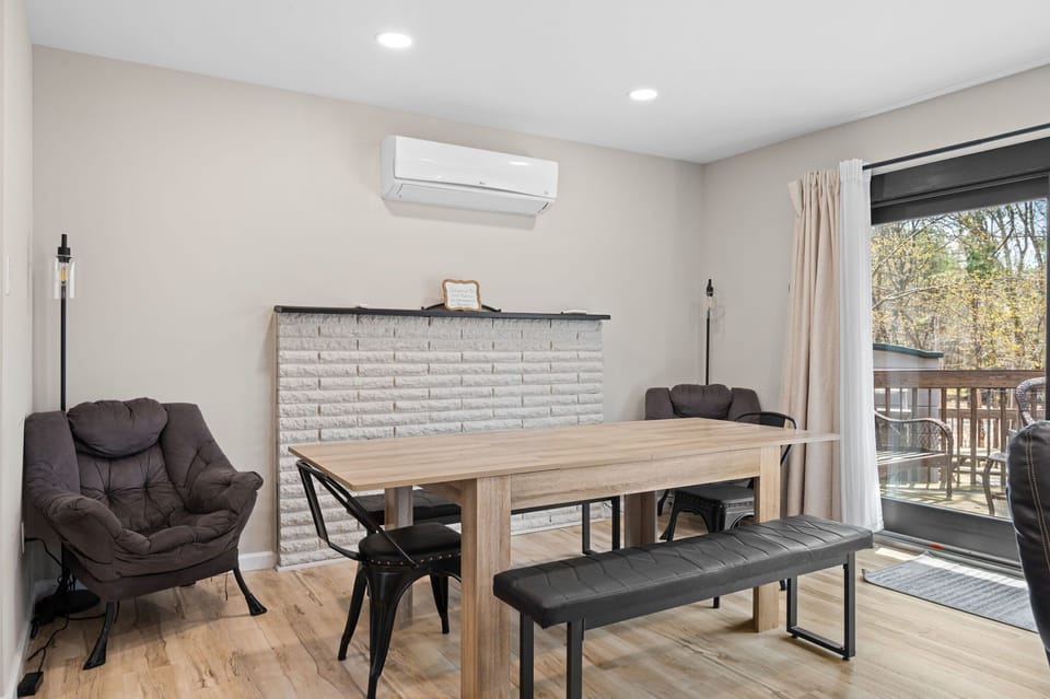 Share meals at the dining table with sliding door access to the deck