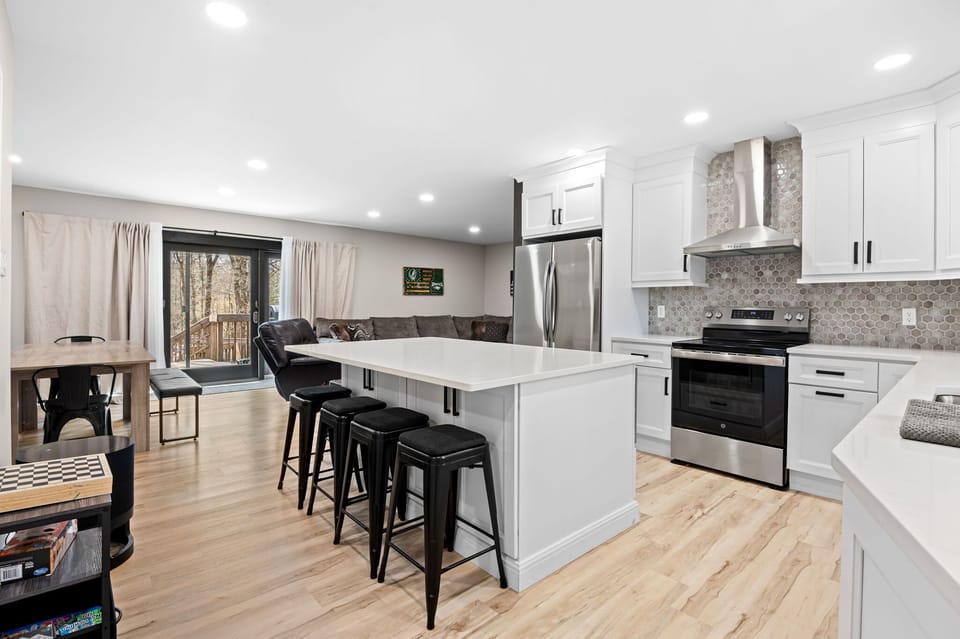 Cook up a feast in this spacious kitchen with island seating for four