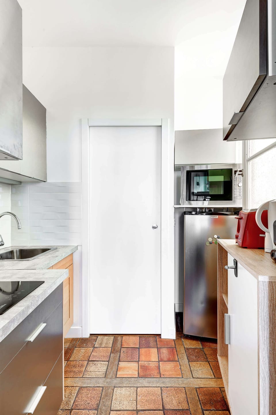 The kitchen is fully equipped to prepare a simple meal 