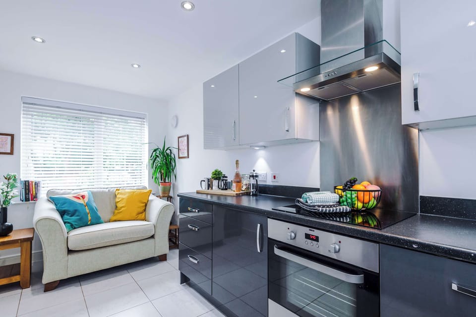 The modern kitchen is equipped with everything you need to prepare a meal whilst away. It features a toaster, kettle, microwave, coffee machine, dishwasher and washing machine!