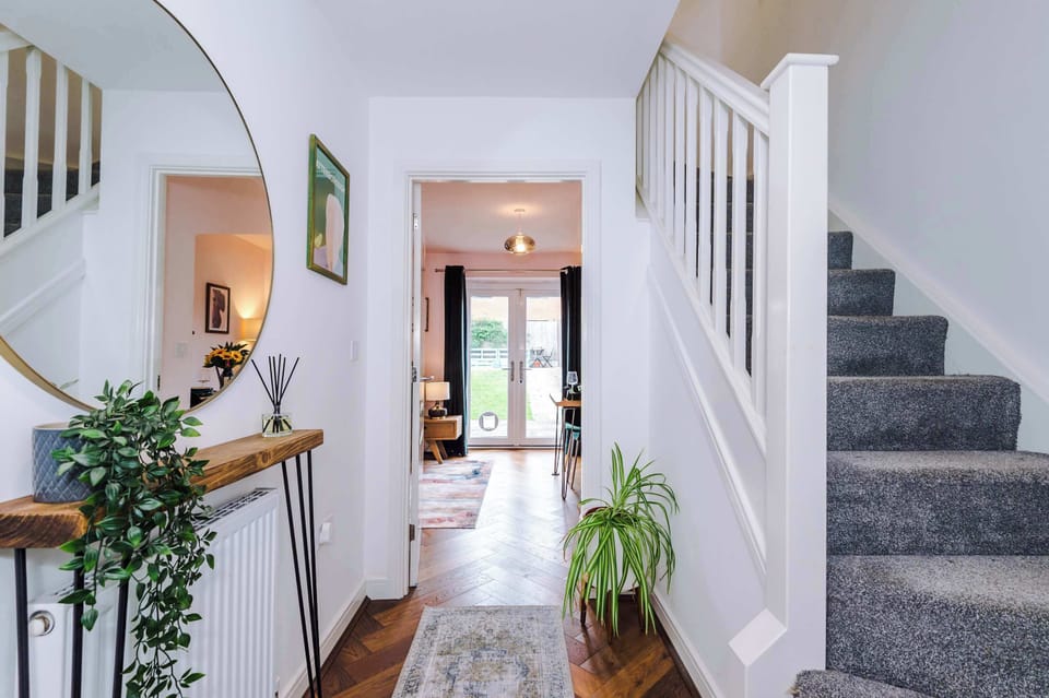 The beautifully decorated hallway welcomes you in to your home away from home in Manchester.
