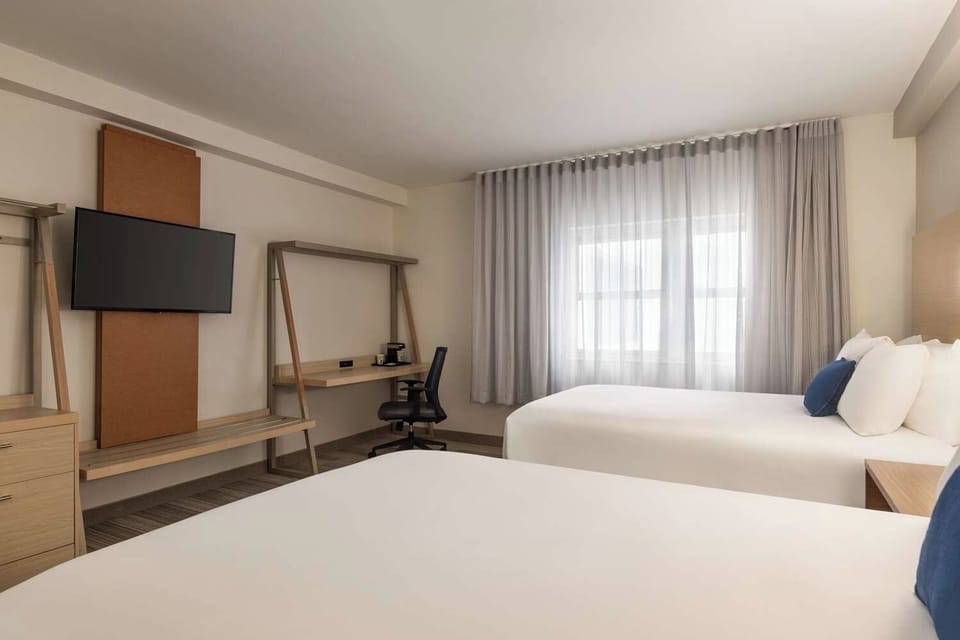 Unit with 2 Double beds. Exact unit will be assigned upon arrival. Views, colors, and decor may vary.
