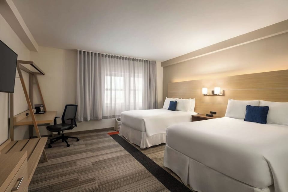 Unit with 2 Double beds. Exact unit will be assigned upon arrival. Views, colors, and decor may vary.