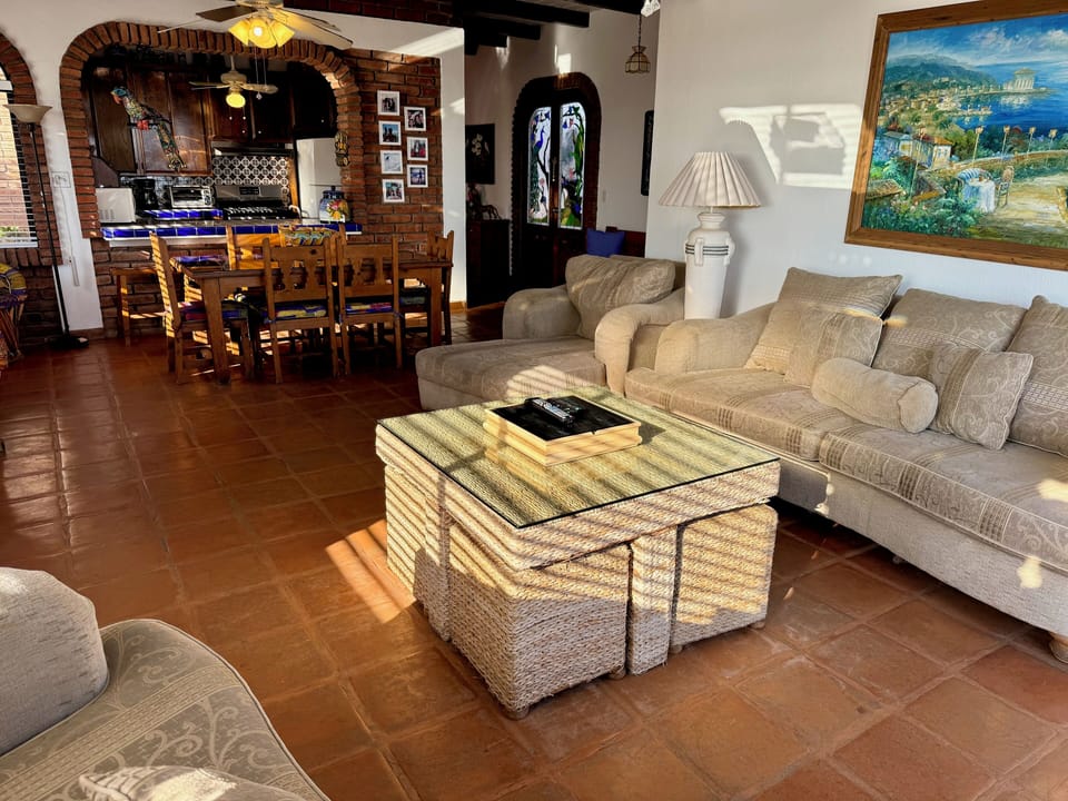 Living room with kitchen in background.