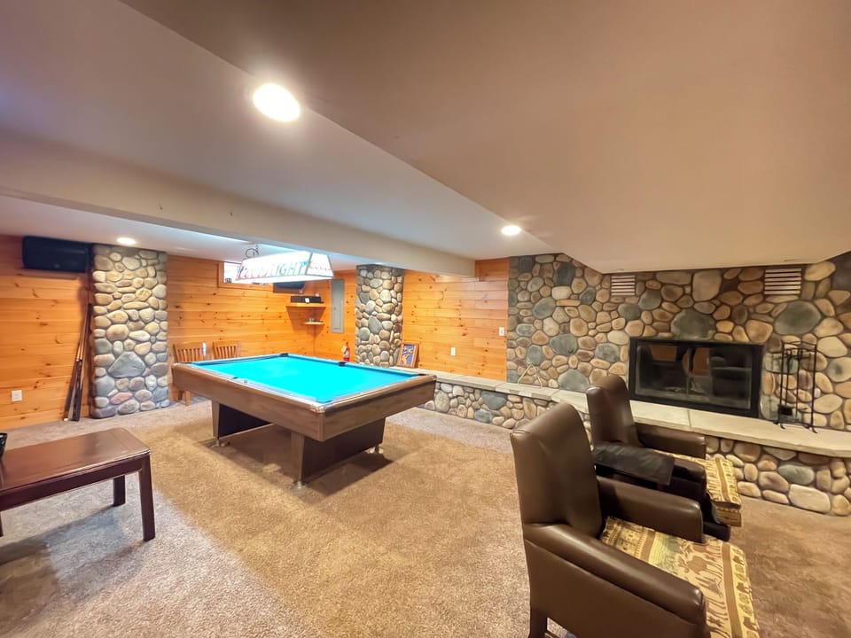 Cozy wood burning fireplace in lower living room